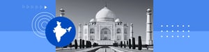 Black‑and‑white view of the Taj Mahal with reflecting pool and gardens on a blue graphic background.