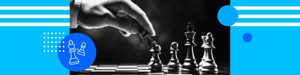 Hand moving a chess piece on a board beside standing pieces, symbolizing strategy, foresight, and competition.