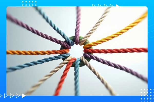 Colourful ropes tied into a central knot, representing collaboration, alignment, and converging business pressures across partnership.