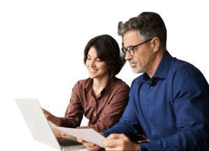 Business colleagues reviewing documents and laptop data together to support strategic planning and decisions.