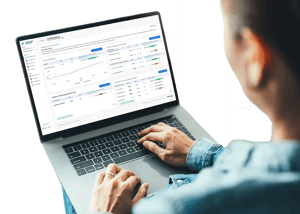 User reviewing LiveLens dashboard on a laptop with performance analytics, metrics, and actionable insights.