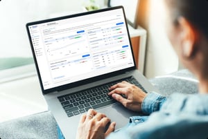 User reviewing LiveLens dashboard on a laptop with performance analytics, metrics, and actionable insights.