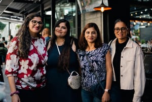 Our employees standing together at a company social event, representing team connection and workplace culture
