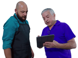 Store staff reviewing order details on a tablet to support retail operations and inventory management