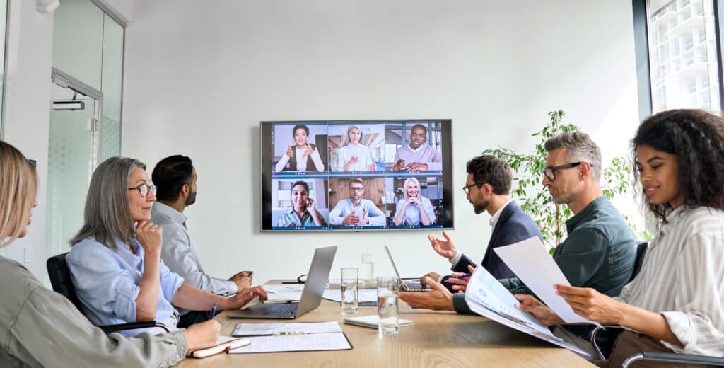 Team members in an office environment in a virtual meeting